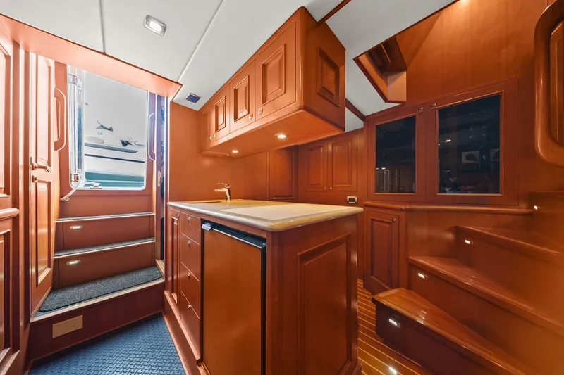 Slide: The Image of Luxurious 2015 Hampton Endurance yacht interior with wooden cabinetry and modern amenities. - 47