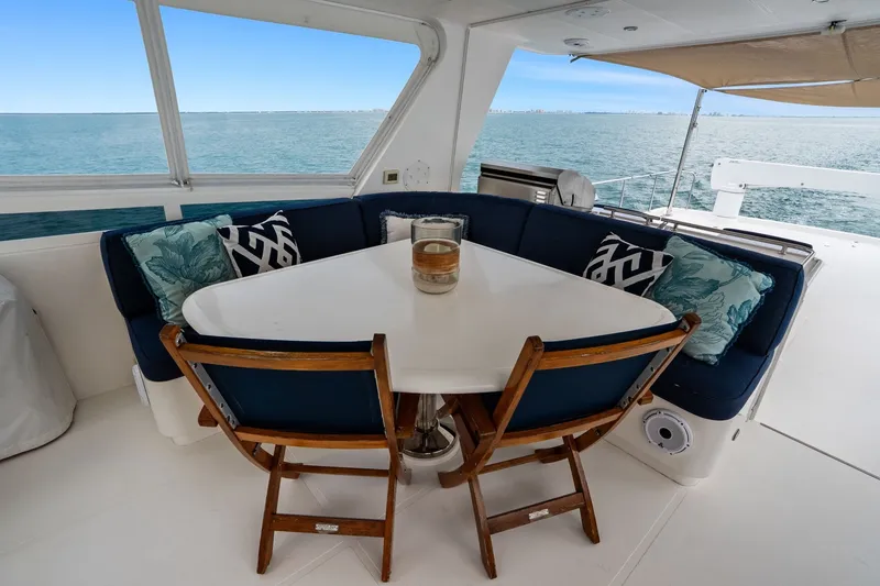 Slide: The Image of Luxurious 2015 Hampton Endurance yacht deck with elegant seating and ocean view. - 69