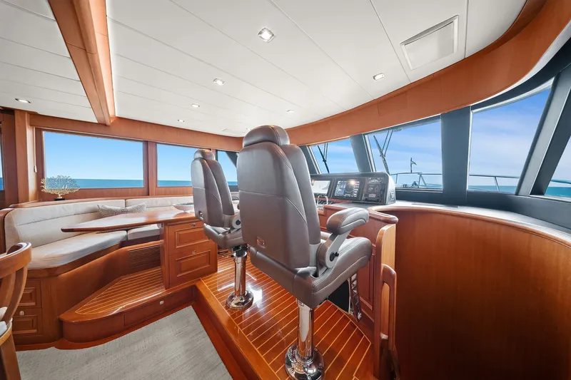 Slide: The Image of Luxurious 2015 Hampton Endurance yacht interior with plush seating and modern navigation controls. - 23