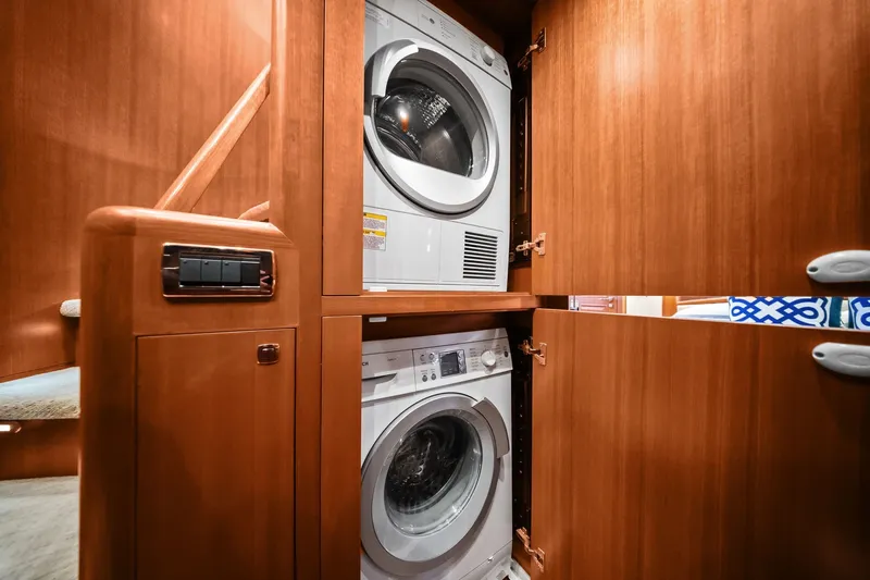 Slide: The Image of Stacked washer and dryer in 2015 Hampton Endurance yacht's wooden cabinet. - 39