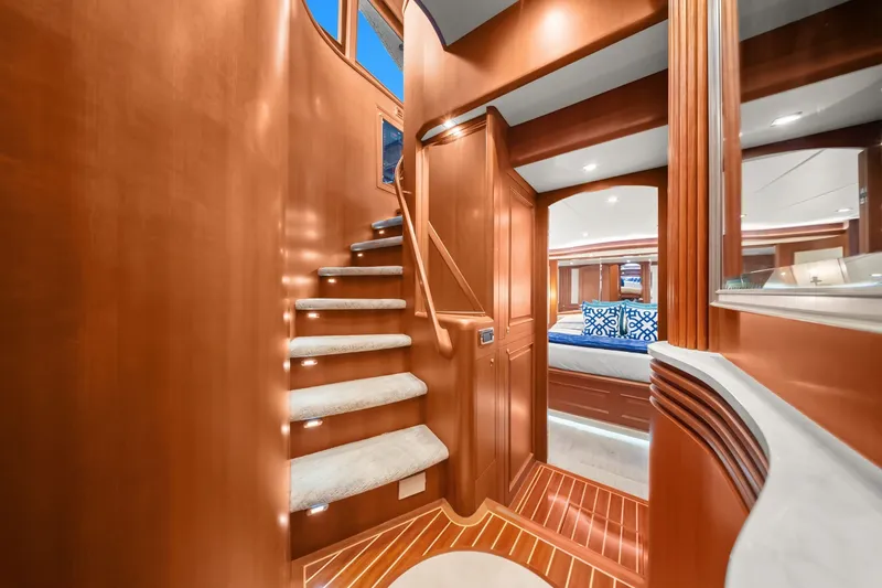 Slide: The Image of Luxurious interior of 2015 Hampton Endurance yacht with elegant wooden staircase and cozy bedroom. - 24