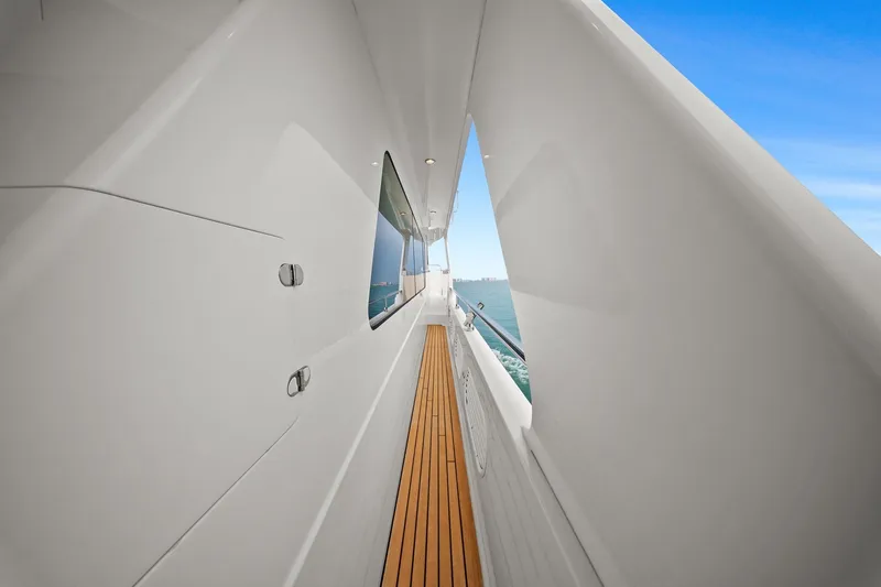 Slide: The Image of Side deck of 2015 Hampton Endurance yacht with teak flooring and ocean view. - 79