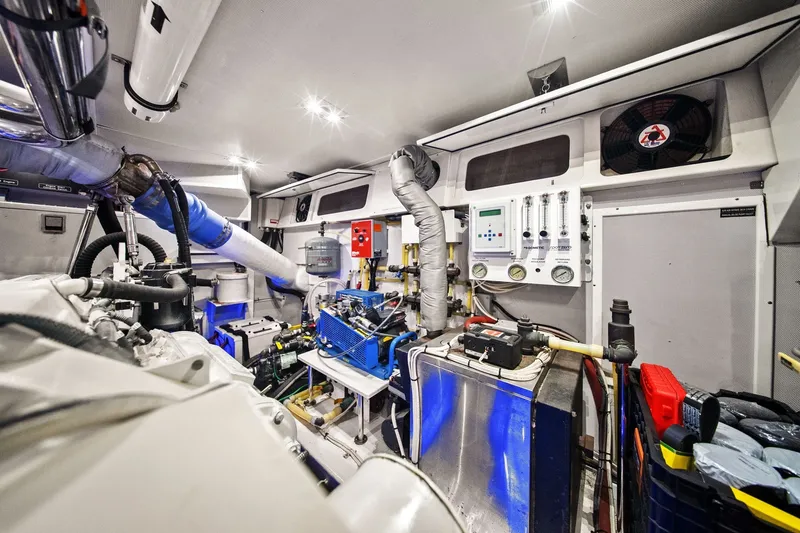 Slide: The Image of Engine room of a 2015 Hampton Endurance yacht, showcasing advanced mechanical systems and equipment. - 63