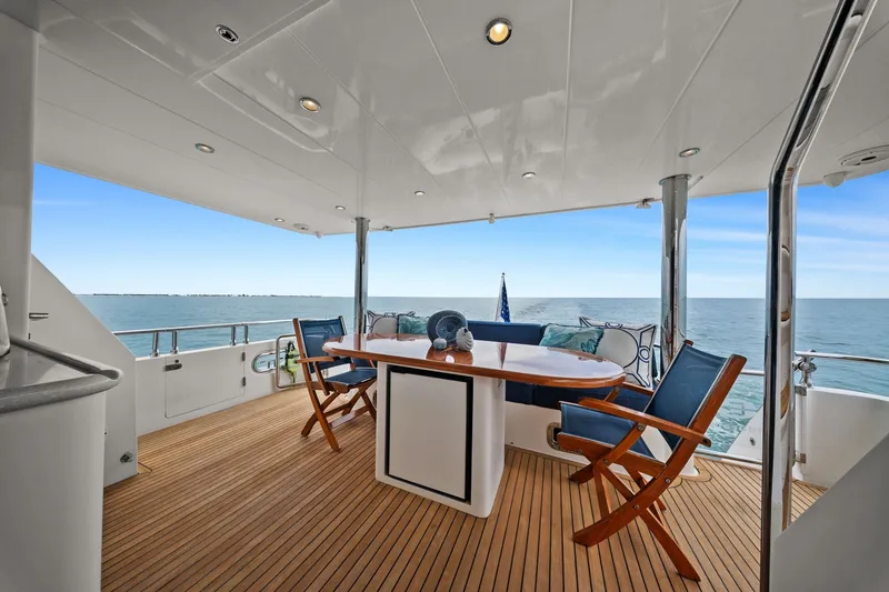 Slide: The Image of Luxurious 2015 Hampton Endurance yacht deck with ocean view and elegant seating. - 85