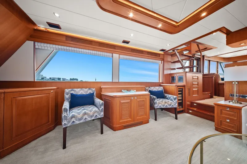 Slide: The Image of Luxurious interior of a 2015 Hampton Endurance yacht with elegant wood finishes and seating. - 11