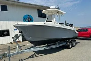 Slide: The Image of 2023 Bayliner 1703 Trophy boat on trailer, parked outside a building. - 11
