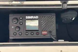Slide: The Image of Simrad marine radio on 2023 Bayliner 1703 Trophy boat dashboard. - 7