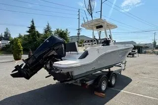 Slide: The Image of 2023 Bayliner 1703 Trophy boat on trailer, parked outdoors under clear sky. - 26