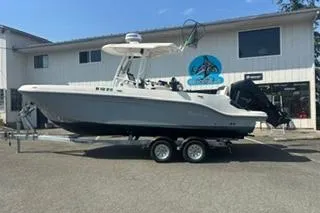 The Image of 2023 Bayliner 1703 Trophy boat on trailer outside a marine dealership. - 1