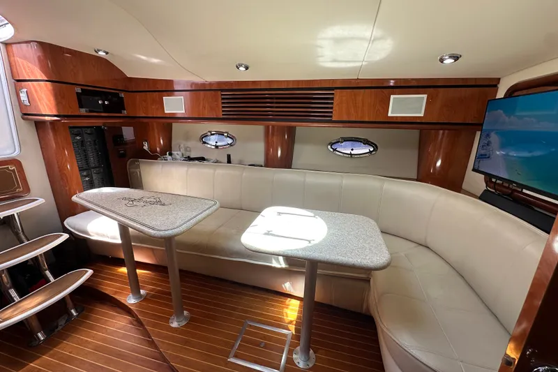 Slide: The Image of Luxurious interior of 2005 Fountain 48 Express Cruiser with leather seating and wood accents. - 25