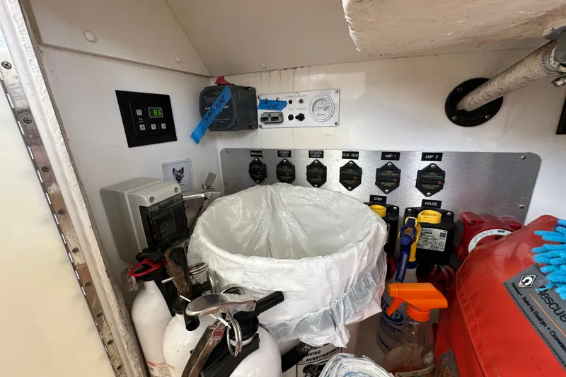 Slide: The Image of Electrical panel and equipment inside a 2005 Fountain 48 Express Cruiser boat. - 13