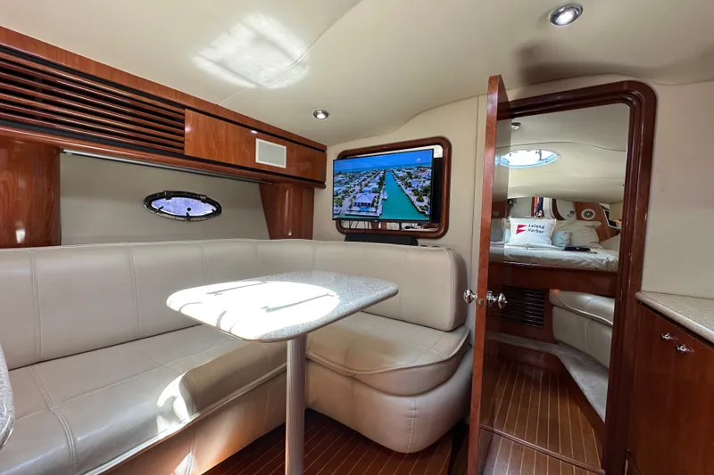 Slide: The Image of Luxurious interior of 2005 Fountain 48 Express Cruiser with leather seating and wood accents. - 24