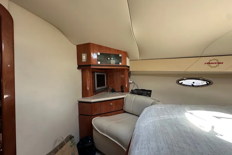 Slide: The Image of Interior of 2005 Fountain 48 Express Cruiser with wood cabinetry and seating area. - 30
