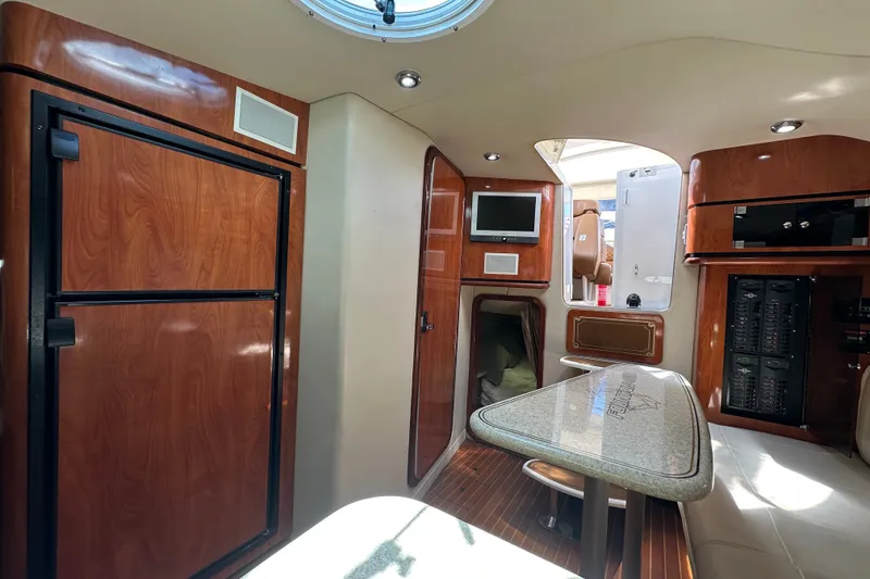 Slide: The Image of Luxurious interior of 2005 Fountain 48 Express Cruiser with wood finishes and modern amenities. - 32