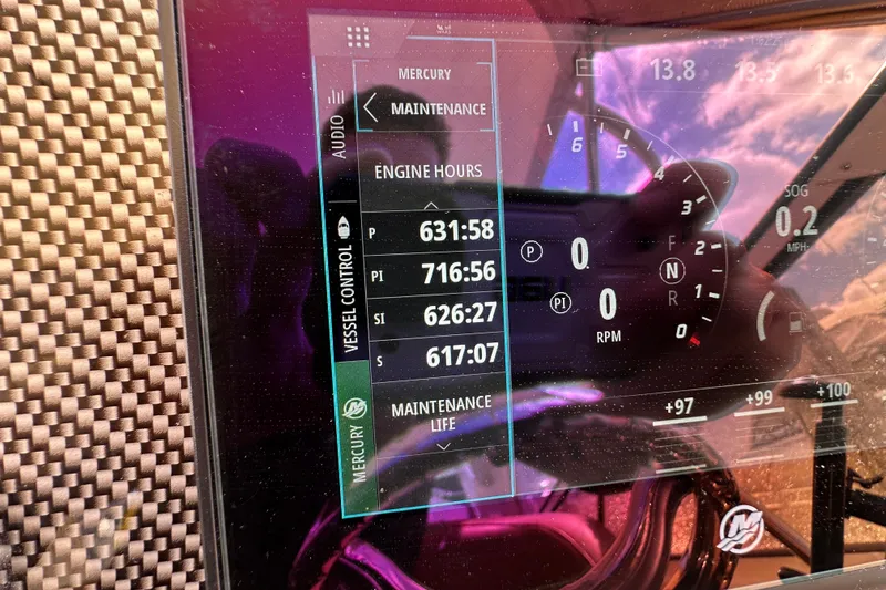 Slide: The Image of Dashboard of a 2005 Fountain 48 Express Cruiser showing engine hours and controls. - 20