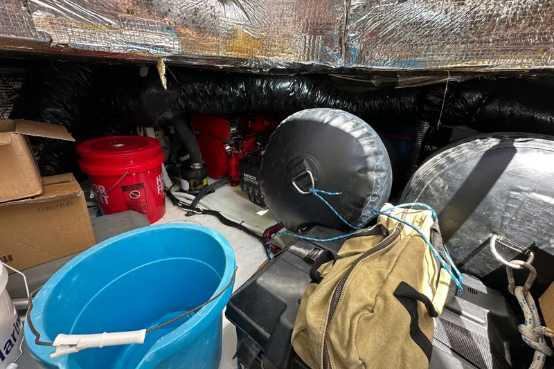Slide: The Image of Storage area of a 2005 Fountain 48 Express Cruiser with buckets and equipment. - 41