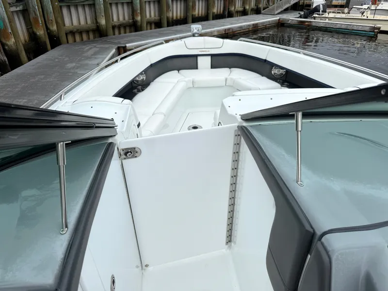 Slide: The Image of The 2014 Formula 350 Crossover Bowrider features an open bow area with white upholstery and gray accents. - 31