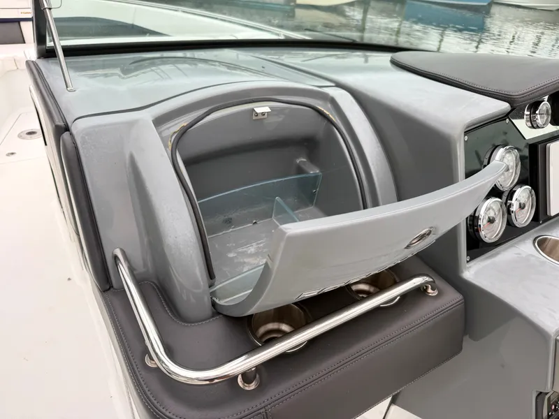 Slide: The Image of The image shows the dashboard of a 2014 Formula 350 Crossover Bowrider with an open storage compartment. - 22