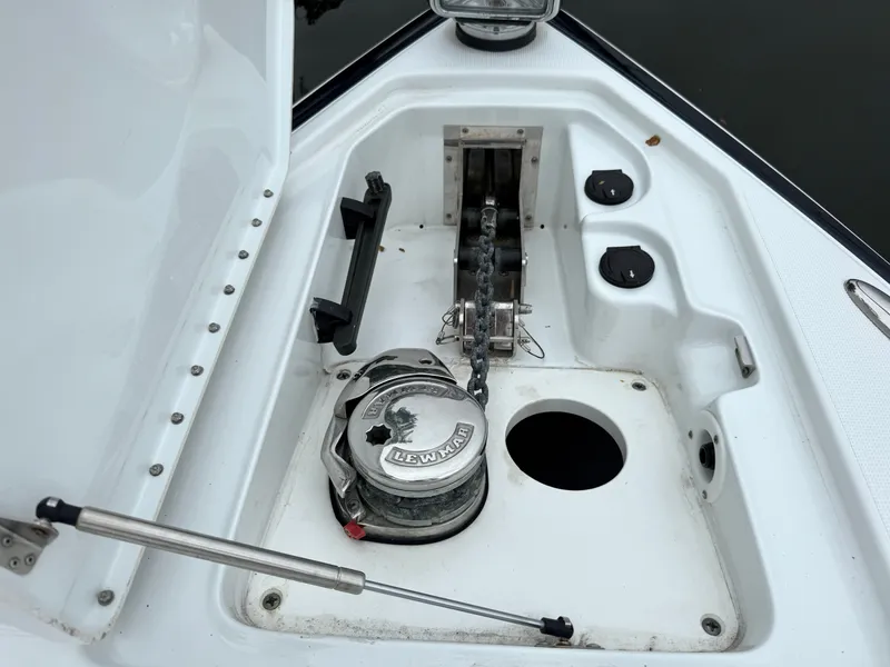 Slide: The Image of The bow area of a boat features an anchor windlass and storage compartment. - 39