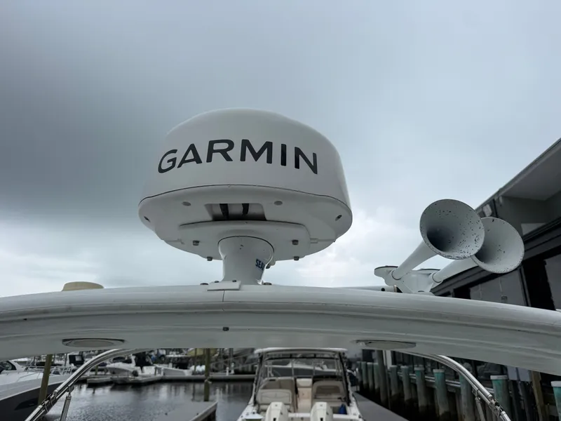 Slide: The Image of A Garmin radar is mounted on a boat, with a gray sky in the background. - 40