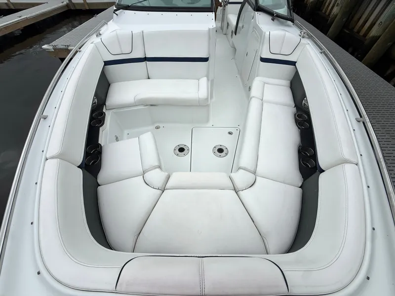 Slide: The Image of The 2014 Formula 350 Crossover Bowrider features a spacious, white cockpit with cushioned seating. - 32