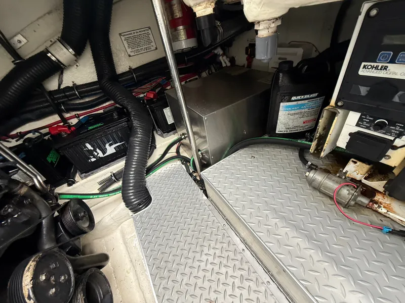 Slide: The Image of The engine room of a boat showing engines, wiring, and technical equipment. - 46