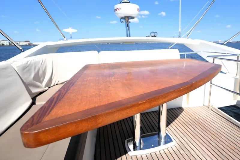 Slide: The Image of Luxurious 2013 Prestige 500 yacht deck with wooden table and ocean view. - 29