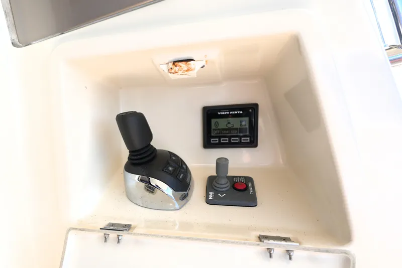 Slide: The Image of Control panel of a 2013 Prestige 500 yacht featuring joystick and Volvo Penta display. - 24