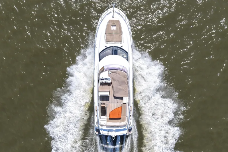 Slide: The Image of Aerial view of a 2013 Prestige 500 yacht cruising on water. - 11