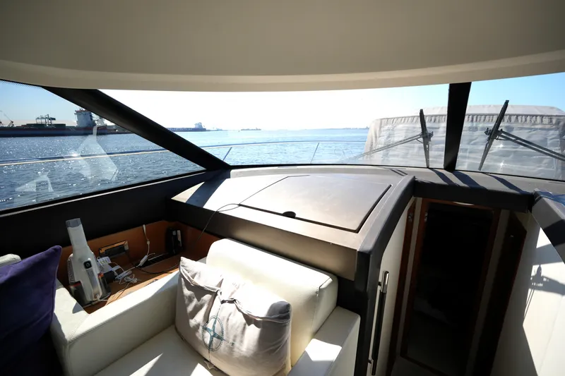 Slide: The Image of Interior view of a 2013 Prestige 500 yacht with ocean backdrop. - 56