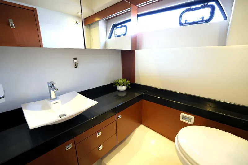 Slide: The Image of Luxurious bathroom interior on a 2013 Prestige 500 yacht, featuring modern fixtures and sleek design. - 85