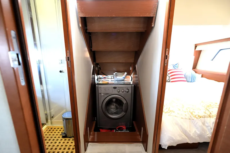 Slide: The Image of Laundry area with washing machine in 2013 Prestige 500 yacht interior. - 74