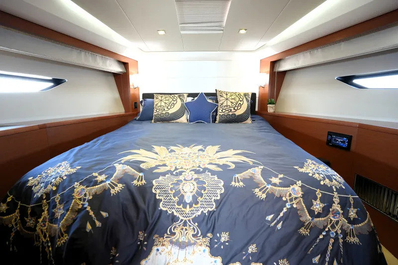 Slide: The Image of Luxurious bedroom interior of 2013 Prestige 500 yacht with elegant bedding and modern design. - 4