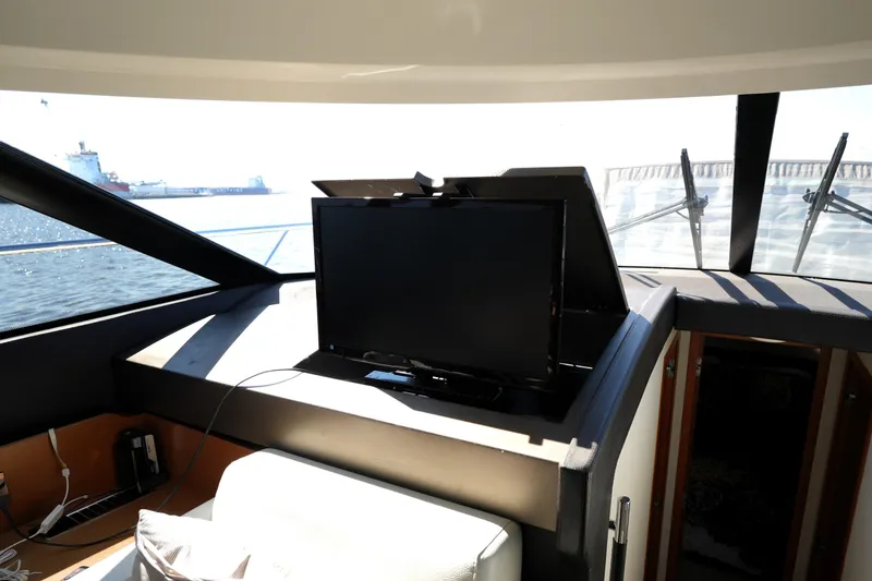 Slide: The Image of Interior of 2013 Prestige 500 yacht with a retractable TV and sea view. - 57