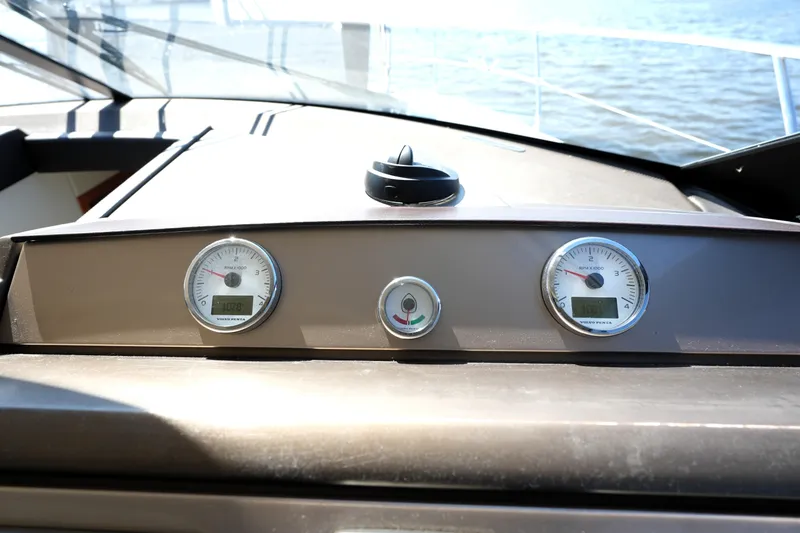 Slide: The Image of Dashboard of a 2013 Prestige 500 yacht with gauges and controls. - 65