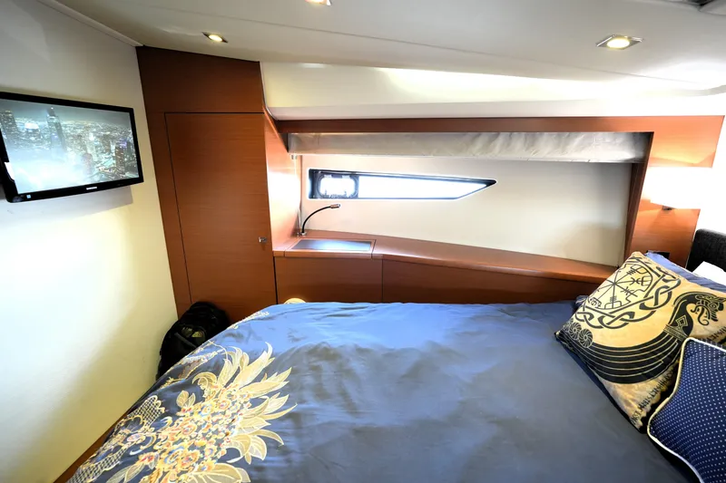 Slide: The Image of Luxurious cabin interior of 2013 Prestige 500 yacht with elegant bedding and modern decor. - 69