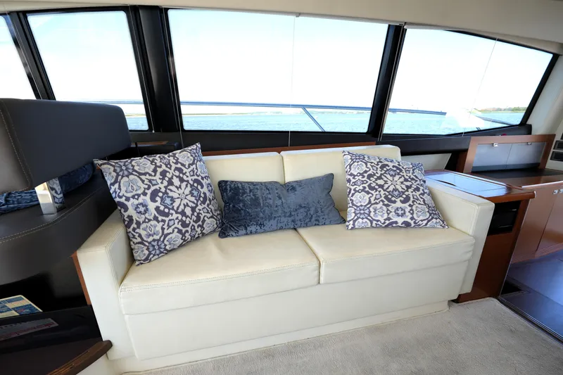 Slide: The Image of Luxurious interior of 2013 Prestige 500 yacht with elegant sofa and decorative pillows. - 58