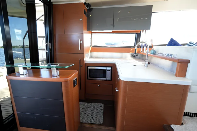 Slide: The Image of Luxurious kitchen interior on a 2013 Prestige 500 yacht, featuring modern appliances and sleek design. - 48