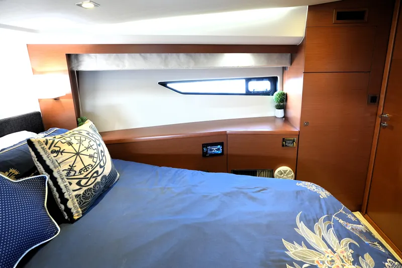 Slide: The Image of Luxurious cabin interior of 2013 Prestige 500 yacht with elegant bedding and modern design. - 70