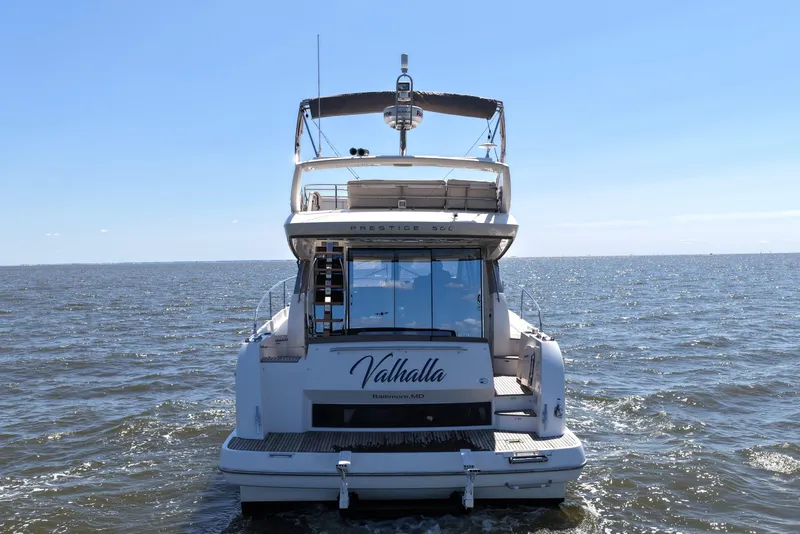 Slide: The Image of Rear view of a 2013 Prestige 500 yacht named Valhalla on open water. - 9