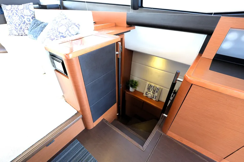 Slide: The Image of Luxurious interior of 2013 Prestige 500 yacht with elegant wood finish and cozy decor. - 76