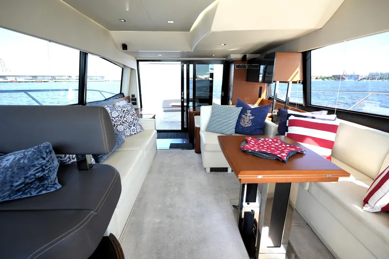 Slide: The Image of Luxurious interior of 2013 Prestige 500 yacht with nautical-themed decor and waterfront view. - 46