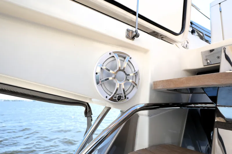 Slide: The Image of Speaker on a 2013 Prestige 500 yacht, near water, showcasing luxury marine design. - 43