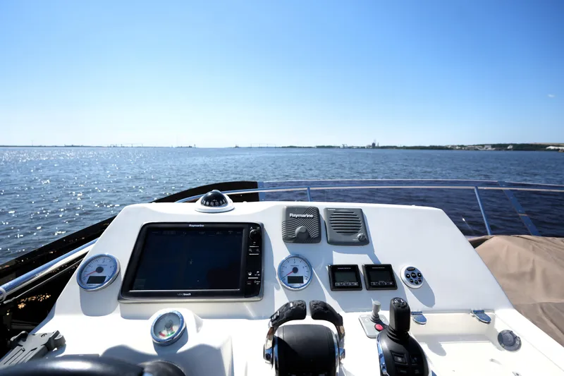 Slide: The Image of Cockpit view of 2013 Prestige 500 yacht navigating on open water. - 33