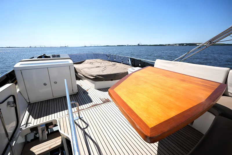 Slide: The Image of Luxury yacht deck of 2013 Prestige 500 with wooden table and ocean view. - 26