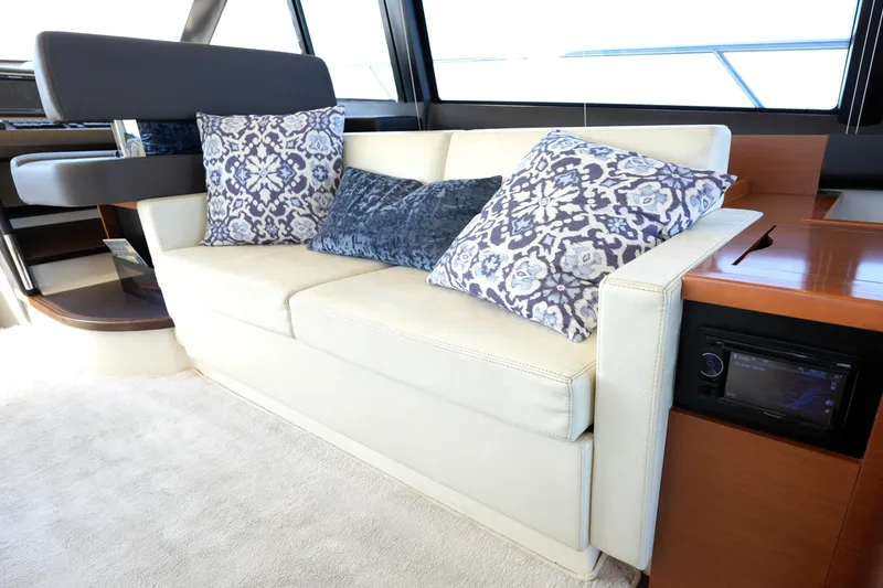 Slide: The Image of Luxurious interior of a 2013 Prestige 500 yacht with elegant sofa and decorative pillows. - 59