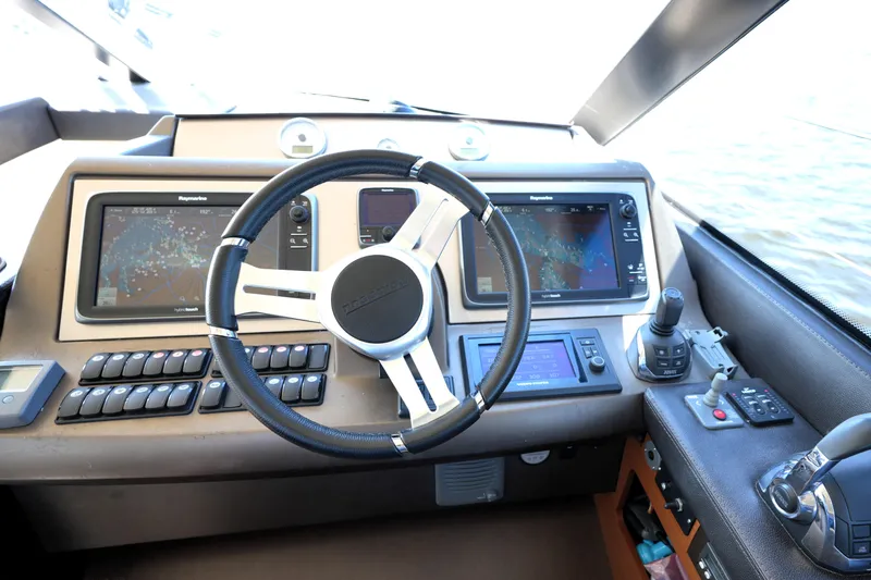 Slide: The Image of Cockpit of 2013 Prestige 500 yacht with advanced navigation systems and controls. - 62