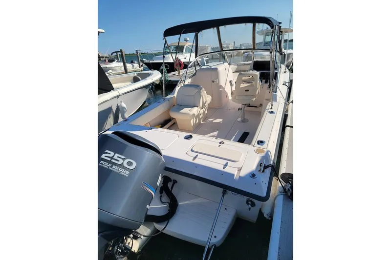 Slide: The Image of 2008 Grady-White Tournament 225 boat with 250 horsepower engine, docked at marina. - 19