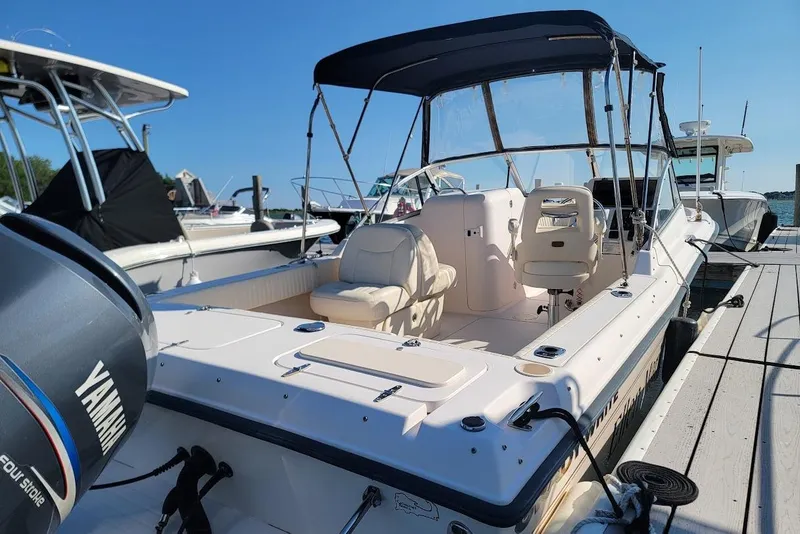 Slide: The Image of 2008 Grady-White Tournament 225 boat docked with Yamaha engine, featuring spacious seating. - 16
