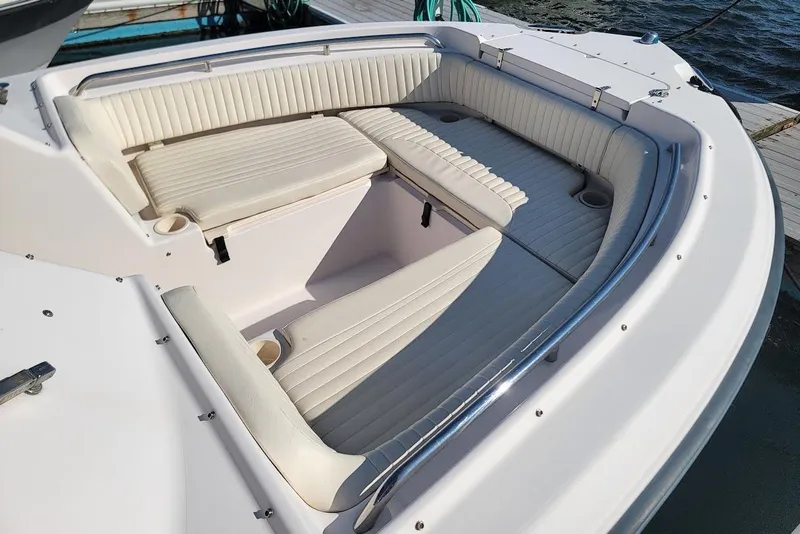 Slide: The Image of 2008 Grady-White Tournament 225 boat with spacious, cushioned seating area. - 11